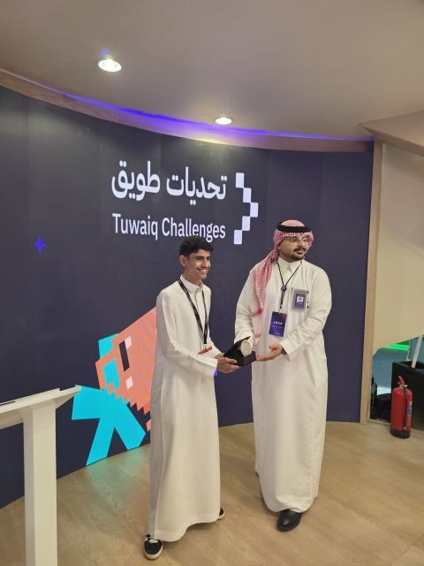 Abdulaziz Alasaiqah receiving the first-place medal at the Tuwaiq Challenges booth during LEAP 2026